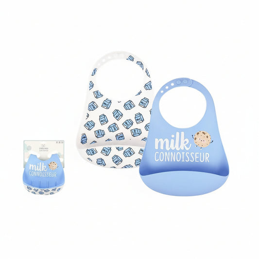 Two baby silicone bibs on a white background: one white bib with a blue milk carton pattern and one light blue silicone bib with 'milk CONNOISSEUR' text and a cookie graphic. Product text and a small packaged version are included on a white layout with the brand 'LITTLE & LOVED'.
