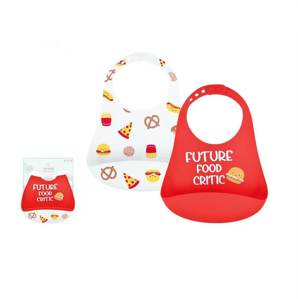 Two silicone baby bibs on a white background with product text and a small package inset. One bib is white with colorful food illustrations, and the other is bright red with the words 'FUTURE FOOD CRITIC' and a burger graphic.