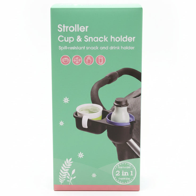 A mint green retail box for a 'Stroller Cup & Snack holder' placed on a countertop in a store. The packaging features white text and an illustration of the cup holder holding a stroller handle and a bottle.