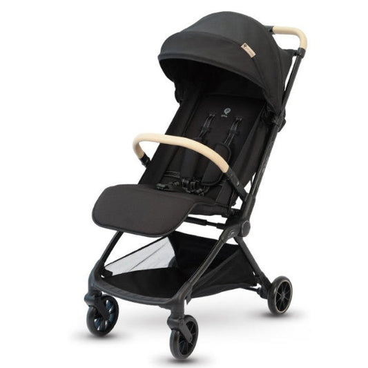 A compact black stroller with light beige wooden handle grips, shown on a clean white background.