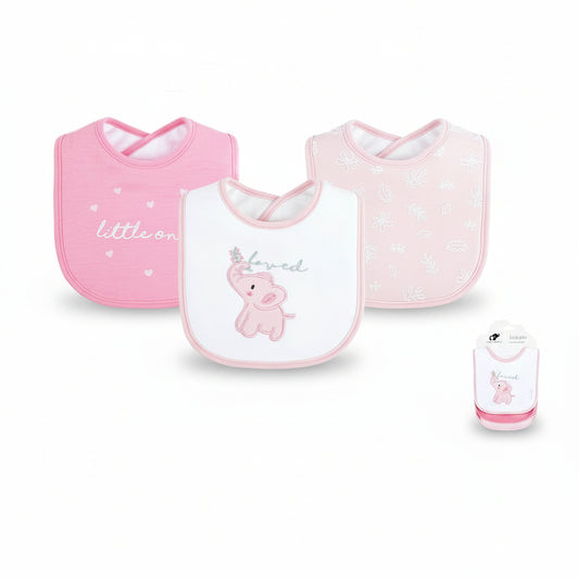 Three baby bibs in pink and white are displayed on a white background with product details text below. The set includes a pink bib with 'little one' text, a white bib with a pink elephant and 'loved' text, and a pale pink bib with floral patterns.